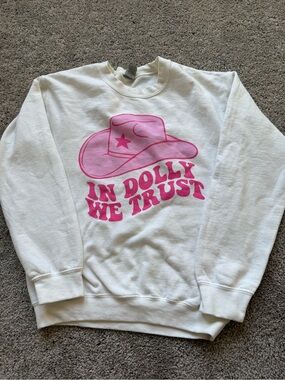 White Sweatshirt with Pink 'In Dolly We Trust' Graphic
